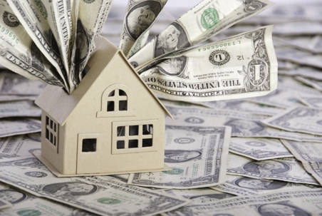 A model house with one dollar bills.
